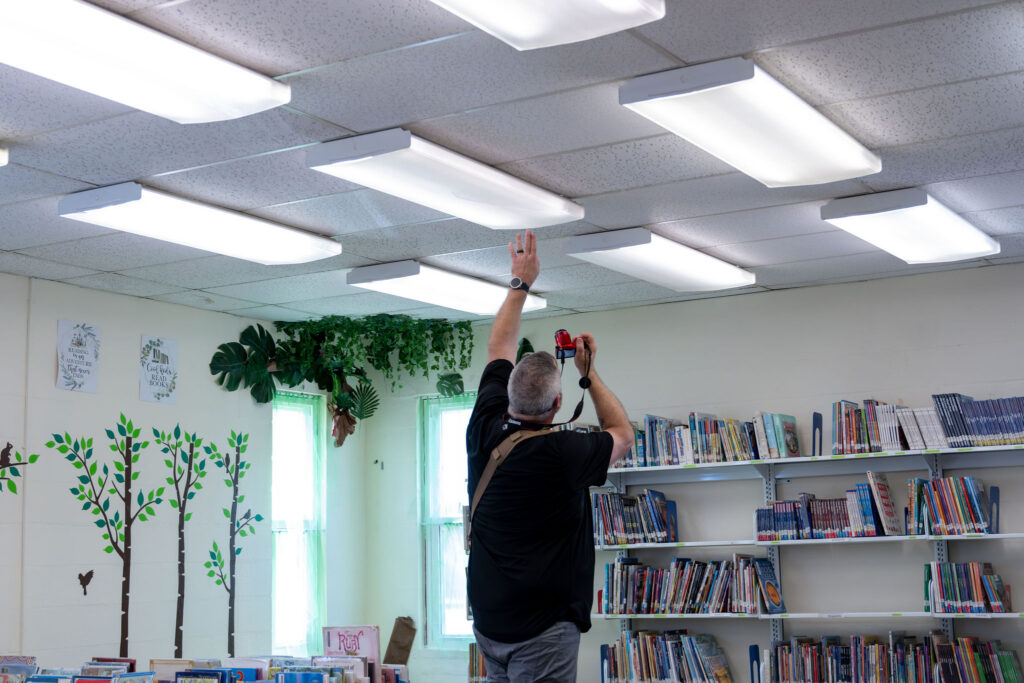 photo of man looking at church lights